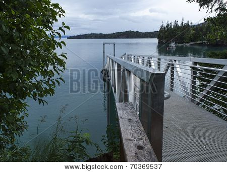 Distant Kayakers Off The Dock