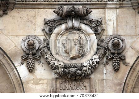 PARIS, FRANCE - NOVEMBER 08, 2012: Architectural details of Opera National de Paris: Cimarosa Facade sculpture. Grand Opera is famous neo-baroque building in Paris, France. UNESCO World Heritage Site.