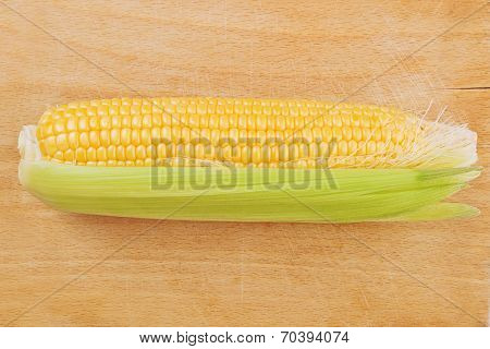 Corn Maize Cob On Wooden Background