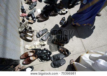 NEW YORK - AUGUST 30: Hindus leave their shoes outside the Sri Ganesa Chaturthi prior to praying in celebration of the birth of Ganesh on August 30, 2003 in Flushing, New York.