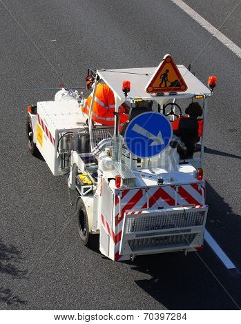 PILSEN CZECH REPUBLIC - AUGUST 19, 2014: Unidentified workers driving maintenance vehicle. Painting new road signs on highway D5 Praha - Rozvadov.