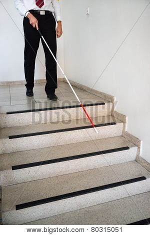 Blind Man Moving Down On Stairway