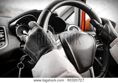 Hands on a steering wheel