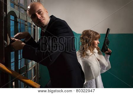 Couple Of Gangsters Is Going To Open The Door With The Master Keys.