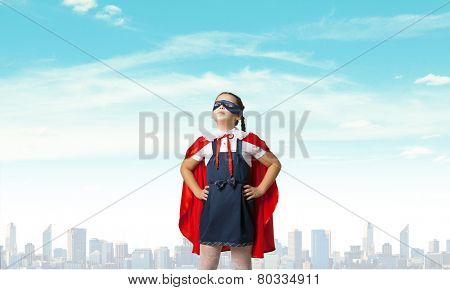 Girl of school age in super hero costume