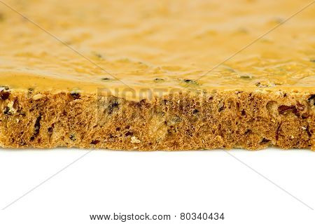 Macro Closeup Of Edge Of Peanut Butter Toast