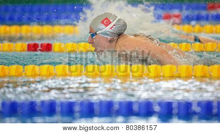 GRAZ, AUSTRIA - APRIL 05, 2014: Melisa Akarsu (Turkey) places 4th in the women's 200m butterfly event in an indoor swimming meeting.