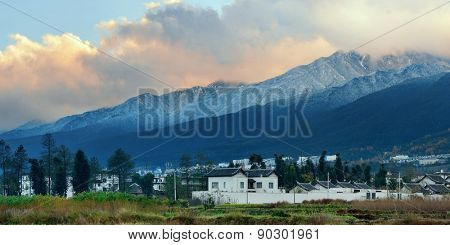 Dali old town rooftop view with snow capped Mt Cangshan. Yunnan, China.