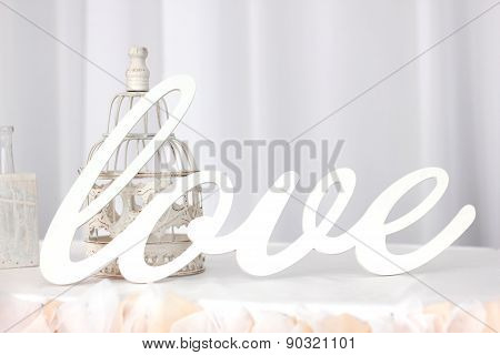 The word Love on silk background