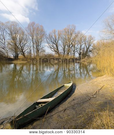 Wooden Boat On Spring River.