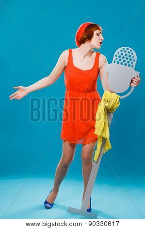 French woman wearing beret. blue background. microphone, singer,