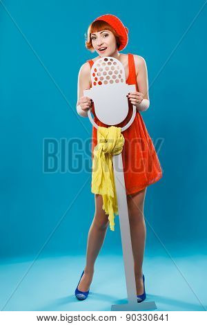 French woman wearing beret. blue background. microphone, singer,