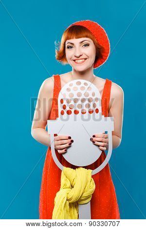 French woman wearing beret. blue background. microphone, singer,