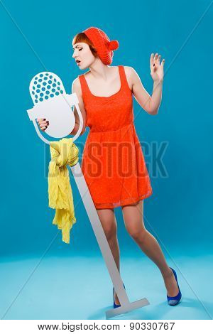 French woman wearing beret. blue background. microphone, singer,