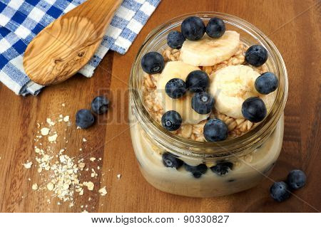 Blueberry and banana breakfast overnight oatmeal in mason jar