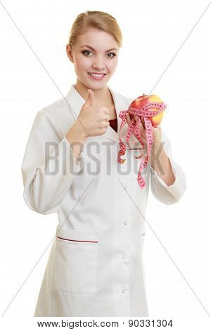 Doctor Specialist Holding Fruit Apple And Measure Tape