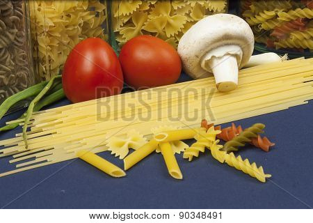 Various types of pasta on the table, homemade food preparation