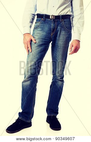 Fashionable mature men in jeans trousers. 
