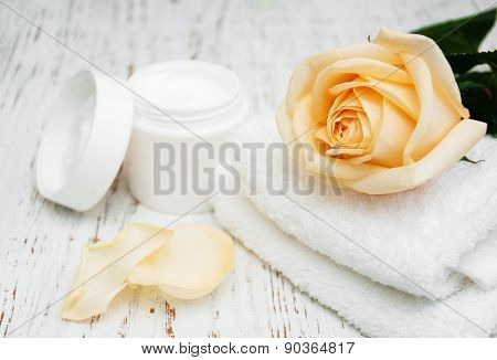 Rose With Moisturiser Cream And Towels
