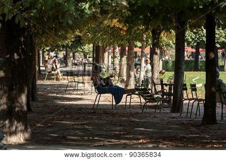 Paris - Local and Tourist in famous Tuileries garden.