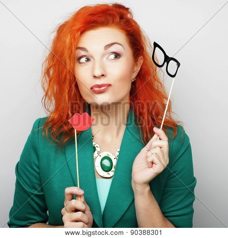 Attractive playful young woman ready for party - falce lips and glasses  