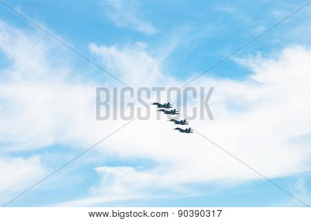 Four Military Fighter Airplanes In White Clouds