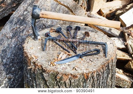 Hew Axe And Metal Hardware On Wooden Block