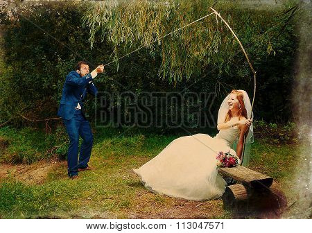 bride cought a groom for her with a fishing rod, Retro variant.