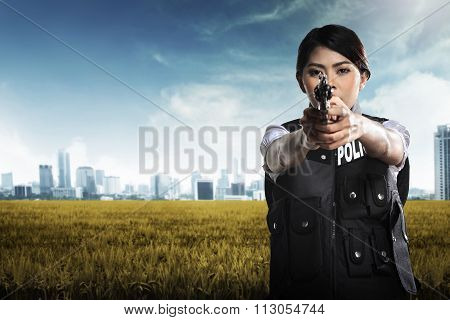 Beautiful Police Woman Holding Gun