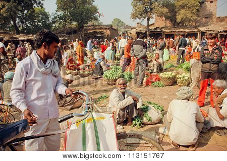 Rural Market In India Full Of Villagers Buying Vegetables And Greens