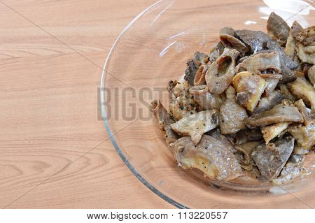 fried pork entrails with garlic on dish