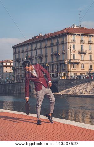 Handsome Asian Model Posing By An Artificial Basin