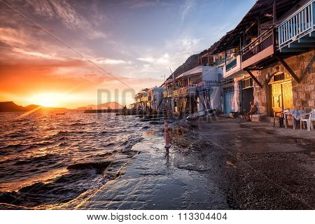 The Typical Little Village Of Klima In Milos Island Greece At Sunset.