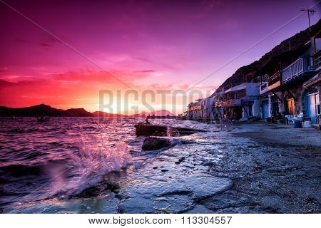 The Typical Little Village Of Klima In Milos Island Greece At Sunset.