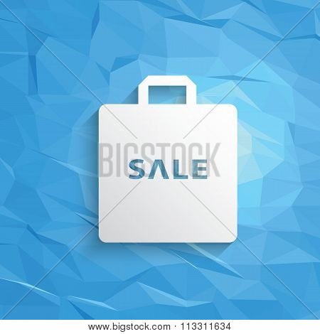 Winter sale symbol of shopping bag and text on blue low poly vector background.