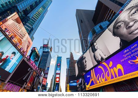 NEW YORK CITY - OCTOBER 13, 2015: Times Square with skyscrapers and neon advertisement. It is one of the worlds busiest pedestrian intersections and a major center of worlds entertainment industry