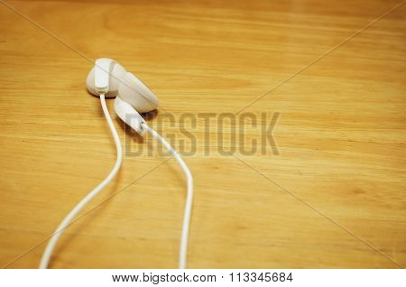 beautiful earplugs on wood surface with color filters vintage