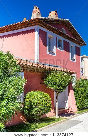 Pink House And Green Trees In Port Grimaud-france