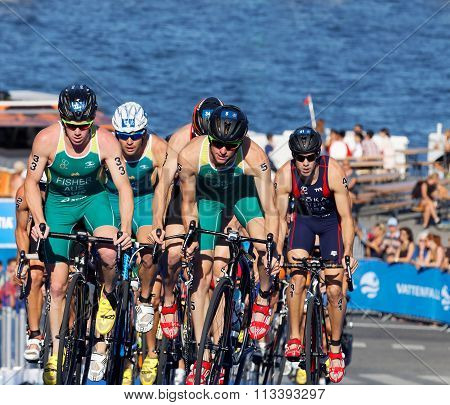 Group Of Australien Triathlon Competitors Cycling Uphill