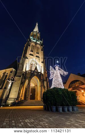 Mariacki Church With Angel In Christmas Night. Katowice