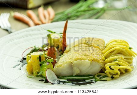 Cod fillet with spinach puree and spaghetti