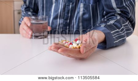Man Taking Pills