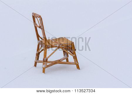 Wicker chair for kids in the snow