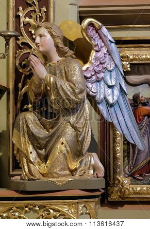STITAR, CROATIA - NOVEMBER 24: Angel statue on the main altar in the church of Saint Matthew in Stitar, Croatia on November 24, 2015