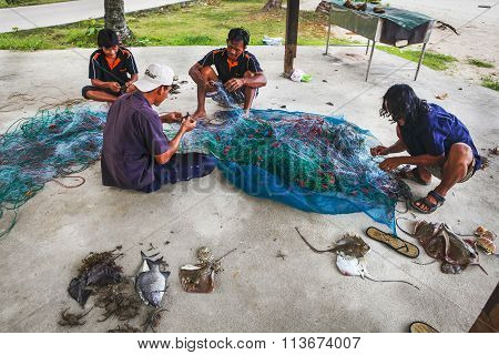 Fishermen On The Dismantled Catch
