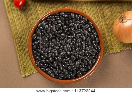 Black Beans On Wooden Background