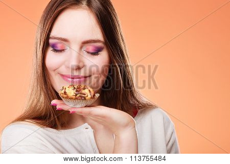 Woman Closed Eyes Holds Cake In Hand