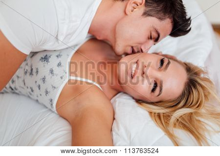 Happy Couple In Bedroom