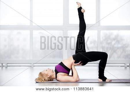 Senior Woman Doing Shoulder Bridge Exercise
