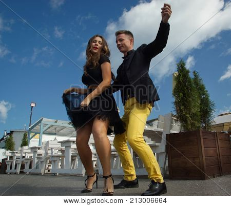 Couple Of Dancers Dancing Bachata On A City Street